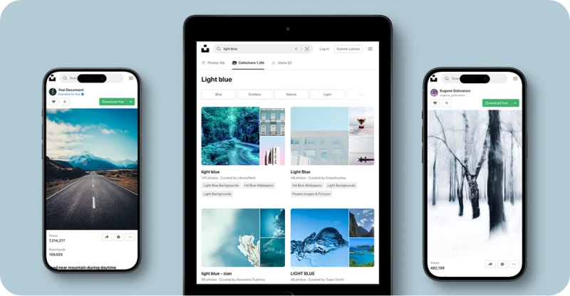 The Unsplash website open on 2 mobile phones and a tablet on a grey background