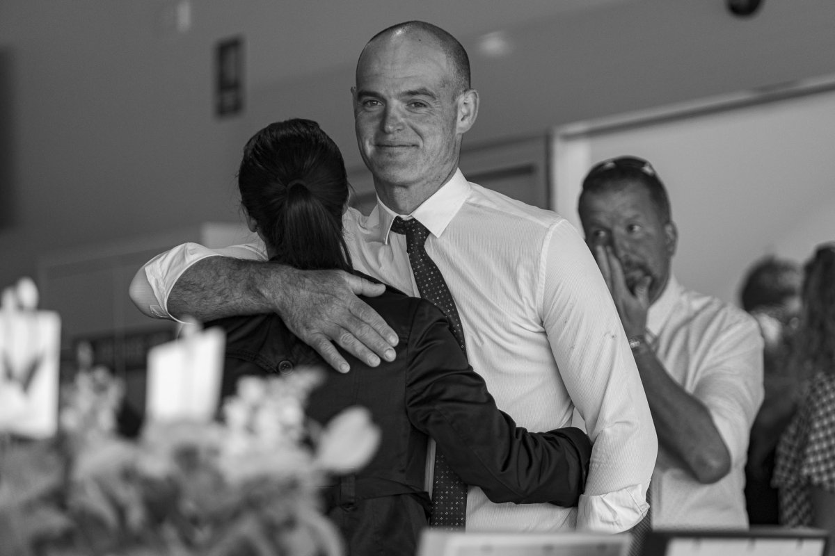 A tender embrace shared during a final farewell, capturing love, connection and remembrance. Picture by Eddie Guerrero