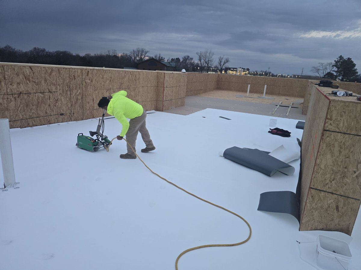 Roofer On Flat Roof