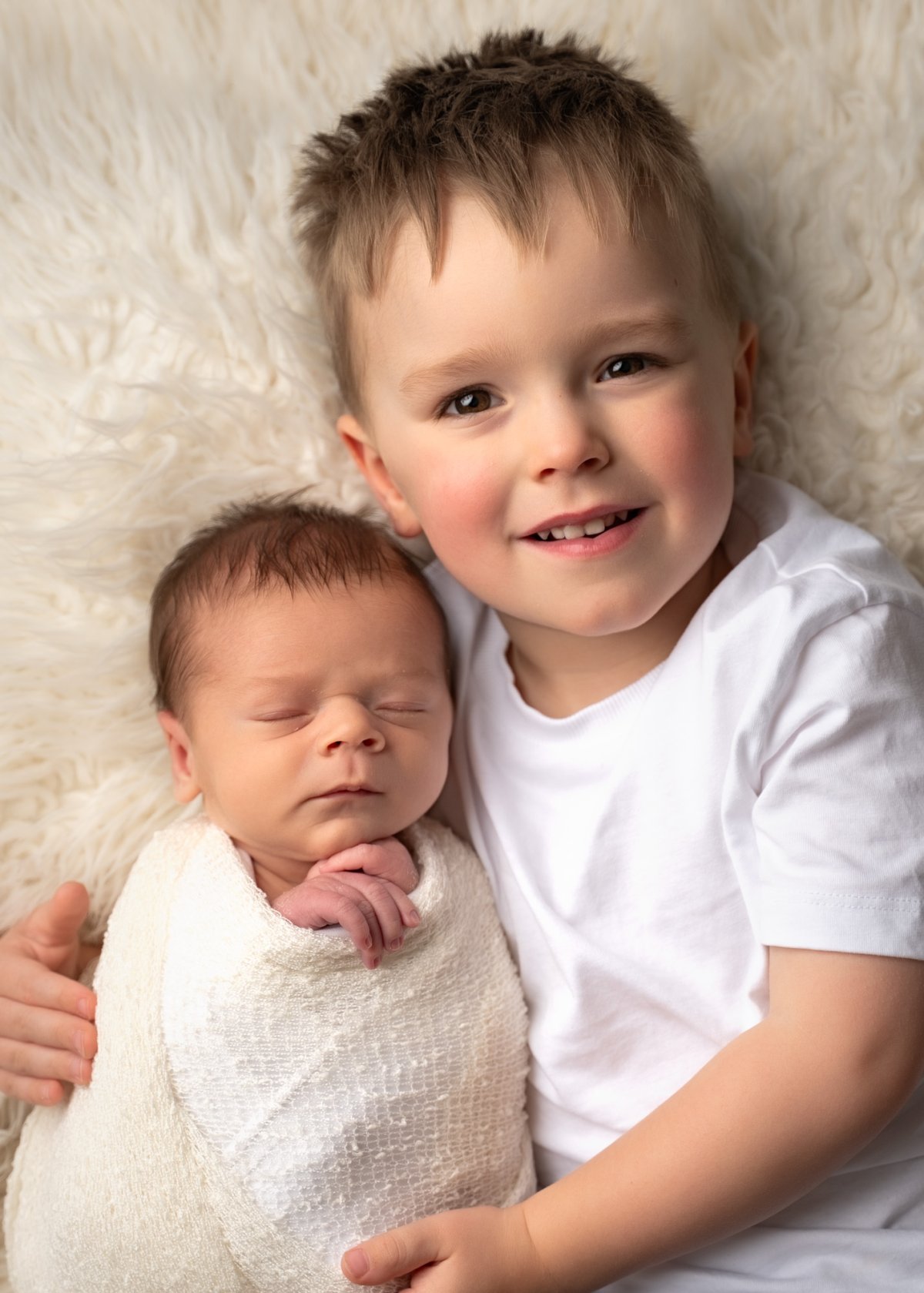 Newborn photoshoot with siblings Lancashire
