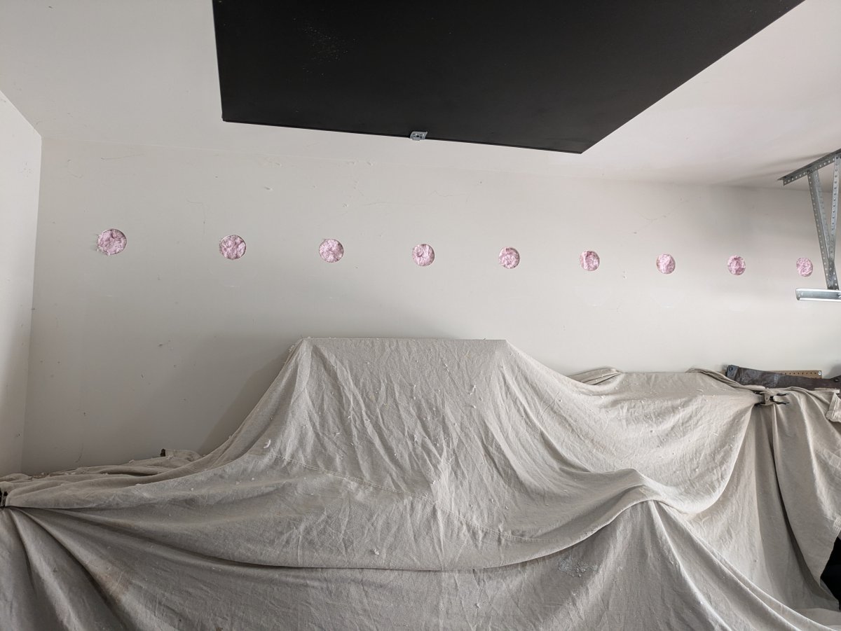 Garage Wall Insulation retrofit with blown in insulation between stud cavities