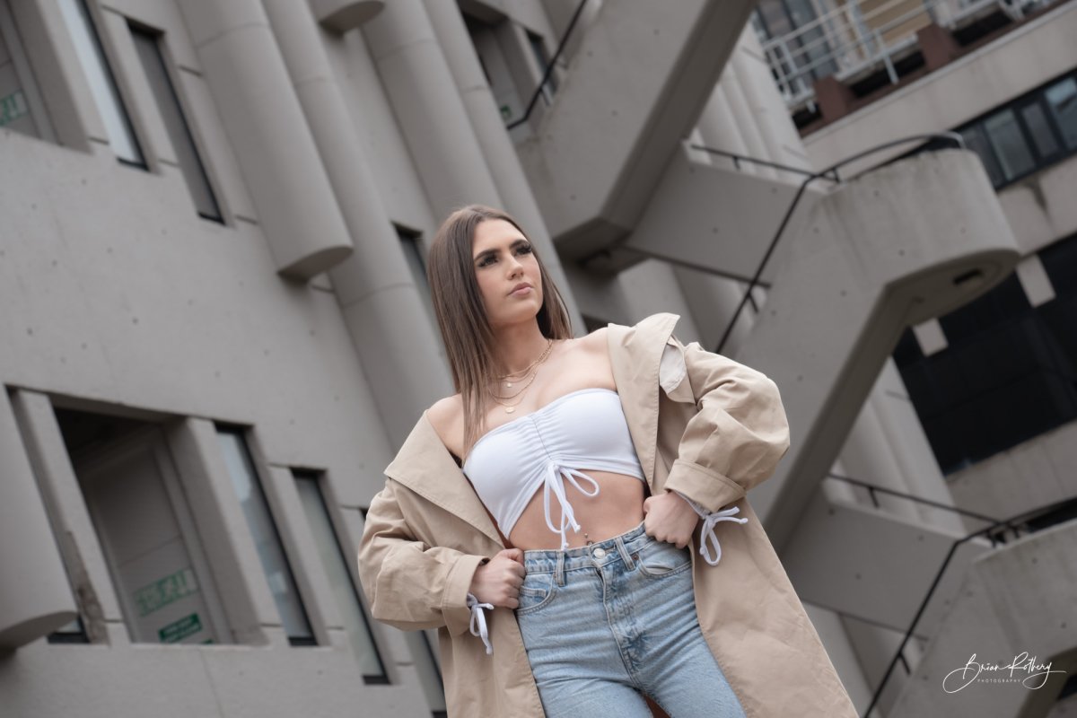 Model against brutalist building Leeds